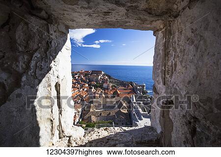 Stock Photograph - The Walls of Dubrovnik surround the old city of Dubrovnik and provide stunning scenery and vantage points around the city; Dubrovnik, Croatia. Fotosearch