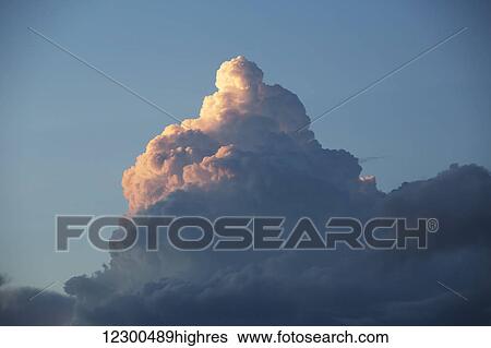 Stock Photograph - Thunderhead forming in evening sky; Edmonton, Alberta, Canada. Fotosearch