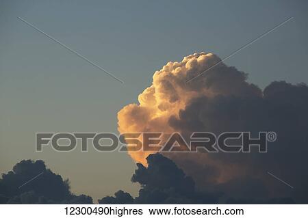 Stock Photograph - Thunderhead forming in evening sky; Edmonton, Alberta, Canada. Fotosearch