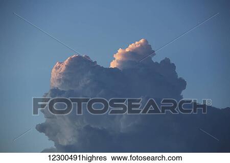 Stock Photograph - Thunderhead forming in evening sky; Edmonton, Alberta, Canada. Fotosearch