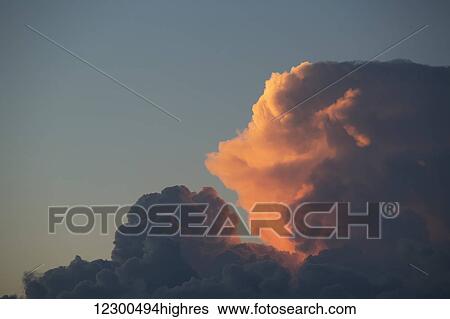 Stock Photograph - Thunderhead forming in evening sky; Edmonton, Alberta, Canada. Fotosearch