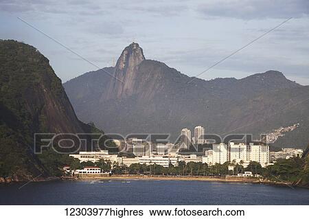 Stock Photograph - Tiburcio Beach and Christ the Redeemer statue; Rio de Janeiro, Brazil. Fotosearch