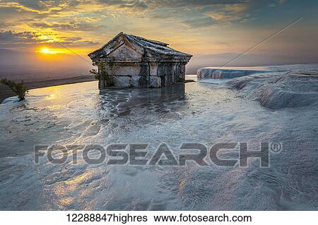 Tomb submerged in a travertine pool in Hierapolis at sunset; Pamukkale, Turkey View Large Photo Image Stock Photograph - Tomb submerged in a travertine pool in Hierapolis at sunset; Pamukkale, Turkey. Fotosearch
