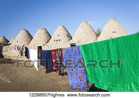Stock Photograph - Traditional mud brick beehive houses; Harran, Turkey. Fotosearch