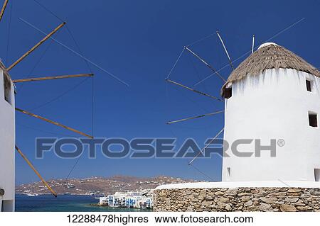 Stock Photograph - Traditional windmills; Chora, Mykonos, Greece. Fotosearch