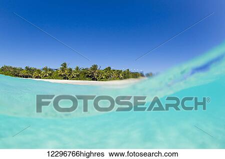 Stock Photograph - Tropical Island, Blue Sky and Beautiful Ocean. Fotosearch