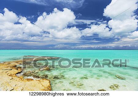 Stock Photograph - Tropical White Sand Beach and Sea In the Turks and Caicos Islands. Fotosearch