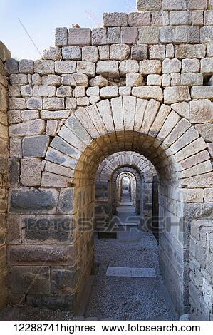 Tunnel between the Temple of Trajan and the theatre on the Acropole, Bergama, Turkey View Large Photo Image Stock Photograph - Tunnel between the Temple of Trajan and the theatre on the Acropole, Bergama, Turkey. Fotosearch
