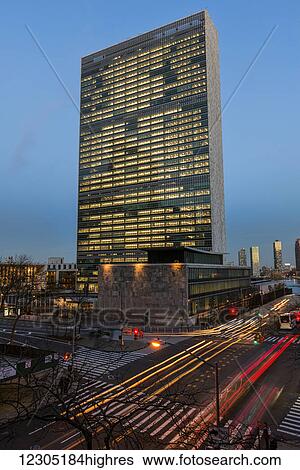 Stock Photograph - United Nations at twilight; New York City, New York, United States of America. Fotosearch