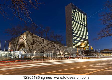 Stock Photograph - United Nations at twilight; New York City, New York, United States of America. Fotosearch