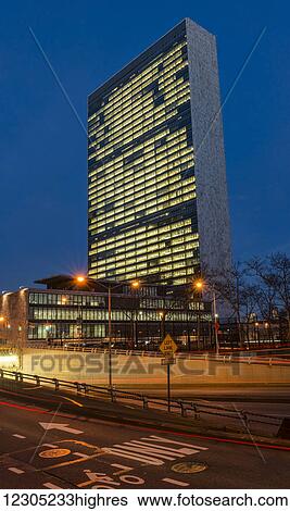 Stock Photograph - United Nations at twilight; New York City, New York, United States of America. Fotosearch