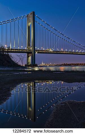 Stock Image - Verazzano-Narrows Bridge at sunset, Fort Wadsworth; Staten Island, New York, United States of America. Fotosearch