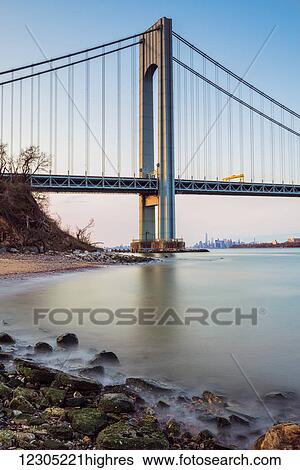 Stock Photograph - Verazzano-Narrows Bridge at sunset, Fort Wadsworth; Staten Island, New York, United States of America. Fotosearch