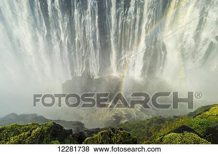 Victoria Falls with rainbow; Livingstone, Zambia View Large Photo Image Stock Photo - Victoria Falls with rainbow; Livingstone, Zambia. Fotosearch