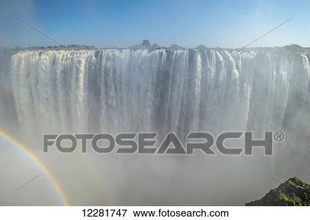 Victoria Falls with rainbow; Zimbabwe View Large Photo Image Stock Photo - Victoria Falls with rainbow; Zimbabwe. Fotosearch