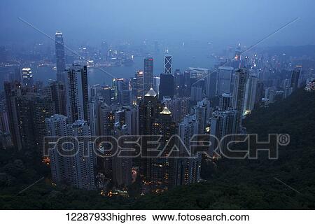 Stock Photograph - Victoria Harbour at dusk from the Peak; Hong Kong, China. Fotosearch