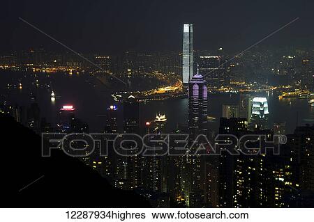 Stock Photograph - Victoria Harbour docks lit up at night; Hong Kong, China. Fotosearch