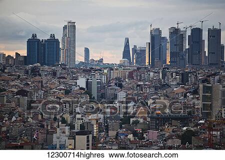 Stock Photograph - View of Levent business district from rooftop bar at dusk; Istanbul, Turkey. Fotosearch