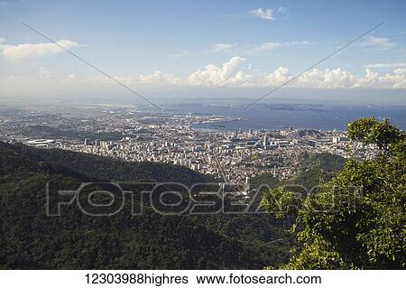 View of Rio city centre from Christ the Redeemer statue, Corcovado mountain, Tijaca National Park; Rio de Janeiro, Brazil View Large Photo Image Stock Photograph - View of Rio city centre from Christ the Redeemer statue, Corcovado mountain, Tijaca National Park; Rio de Janeiro, Brazil. Fotosearch