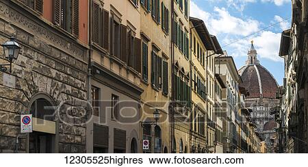 View of the dome roof of a church past rows of residential and retail buildings; Florence, Toscana, Italy View Large Photo Image Stock Photograph - View of the dome roof of a church past rows of residential and retail buildings; Florence, Toscana, Italy. Fotosearch