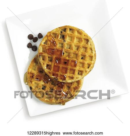 Waffles, syrup and chocolate chips on an white plate against a white background; Toronto, Ontario, Canada View Large Photo Image Stock Photograph - Waffles, syrup and chocolate chips on an white plate against a white background; Toronto, Ontario, Canada. Fotosearch