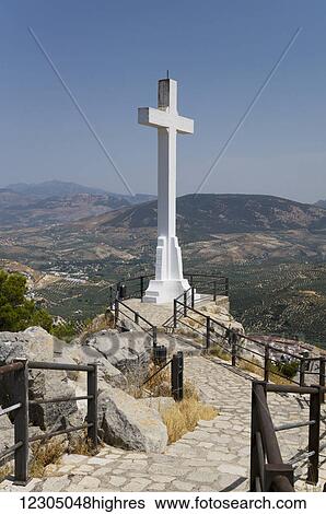 Walkway with railing to a large, white stone cross with mountains in the distance; Jaen, Spain View Large Photo Image Stock Photograph - Walkway with railing to a large, white stone cross with mountains in the distance; Jaen, Spain. Fotosearch