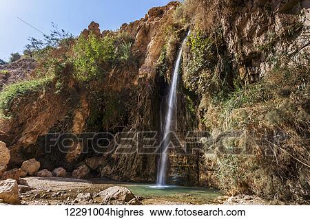 Water flowing out of a rock cliff; Israel View Large Photo Image Stock Photograph - Water flowing out of a rock cliff; Israel. Fotosearch
