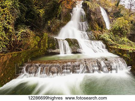 Stock Photograph - Waterfalls from the Edessaios river with autumn coloured foliage; Edessa, Greece. Fotosearch