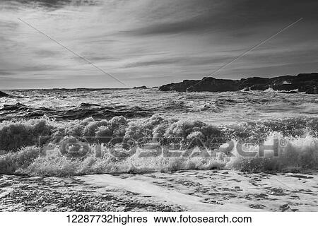 Stock Photograph - Waves rolling on shore; Tofino, British Columbia, Canada. Fotosearch