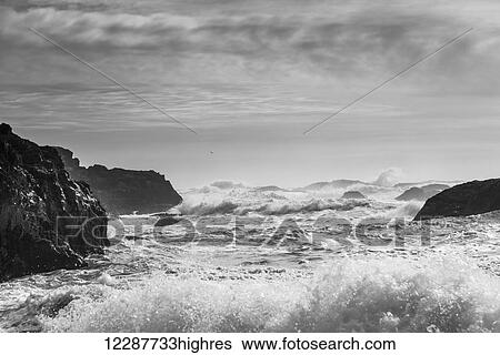 Stock Photograph - Waves rolling on shore; Tofino, British Columbia, Canada. Fotosearch