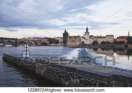 Stock Photograph - Weir and canal entrance on the Vltava River; Prague, Czech Republic. Fotosearch
