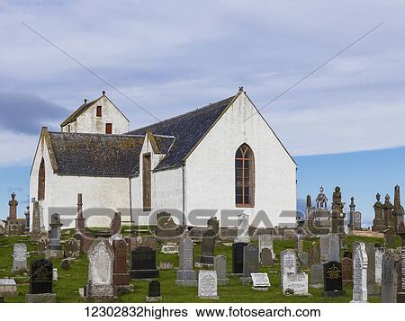 Stock Photograph - White church and cemetery, Highlands; Scotland. Fotosearch