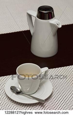 White espresso cup with coffee beside pot; Ankara, Turkey View Large Photo Image Stock Photograph - White espresso cup with coffee beside pot; Ankara, Turkey. Fotosearch