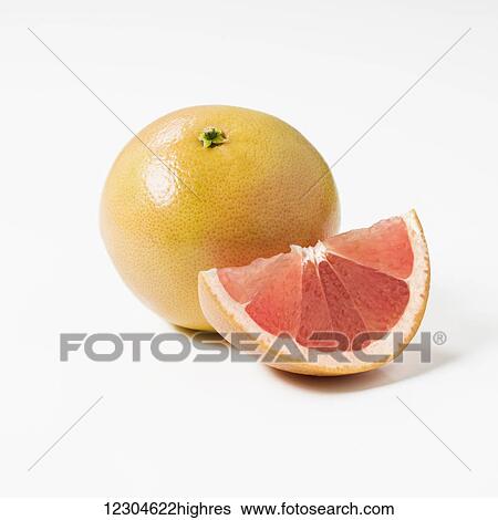 Whole grapefruit and a slice on a white background; Toronto, Ontario, Canada View Large Photo Image Stock Photograph - Whole grapefruit and a slice on a white background; Toronto, Ontario, Canada. Fotosearch
