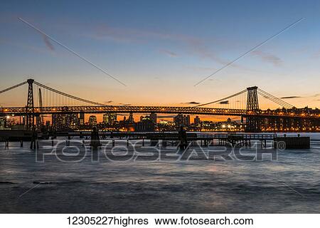 Williamsberg Bridge at sunset; New York City, New York, United States of America View Large Photo Image Stock Photograph - Williamsberg Bridge at sunset; New York City, New York, United States of America. Fotosearch