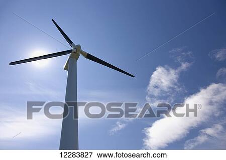 Stock Photo - Wind turbine against a blue sunny sky, Sand Point, Southwestern Alaska, USA, Summer. Fotosearch