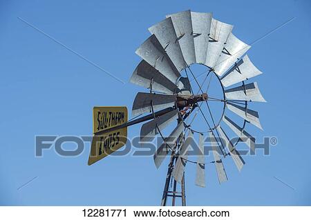 Stock Image - Windmill against clear blue sky; Namibia. Fotosearch