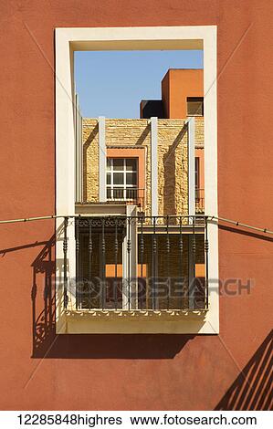 Stock Photograph - Window on an orange well; Cartagena, Murcia Province, Spain. Fotosearch