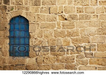 Window with blue glass on a stone wall; Joppa, Israel View Large Photo Image Stock Photograph - Window with blue glass on a stone wall; Joppa, Israel. Fotosearch