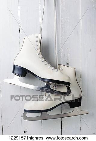 Women's figure skates hanging; Montreal, Quebec, Canada View Large Photo Image Stock Photograph - Women's figure skates hanging; Montreal, Quebec, Canada. Fotosearch