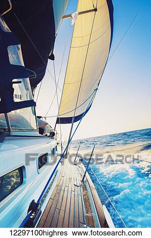 Stock Photograph - Yacht, Sailing boat in the sea. Fotosearch