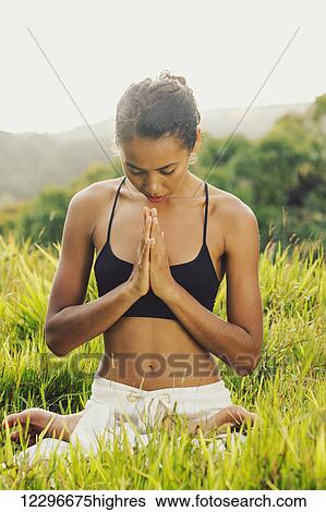 Stock Photograph - yoga woman outside in nature. Fotosearch