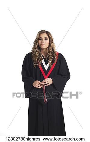 Young graduating woman holding her graduation cap and contemplating her graduation; Edmonton, Alberta, Canada View Large Photo Image Stock Photograph - Young graduating woman holding her graduation cap and contemplating her graduation; Edmonton, Alberta, Canada. Fotosearch