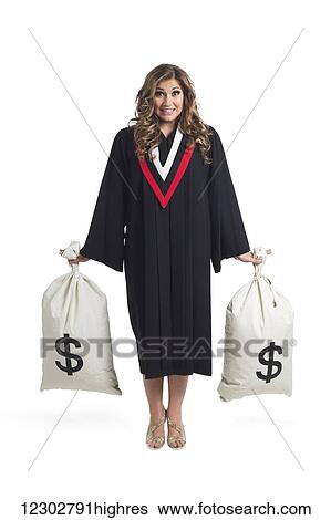 Young graduating woman holding money bags to symbolize the costs of her education; Edmonton, Alberta, Canada View Large Photo Image Stock Photograph - Young graduating woman holding money bags to symbolize the costs of her education; Edmonton, Alberta, Canada. Fotosearch