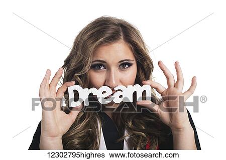 Stock Photograph - Young woman dreaming about her future now that she has graduated; Edmonton, Alberta, Canada. Fotosearch
