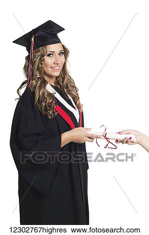 Young woman graduate being handed her diploma for her graduation; Edmonton, Alberta, Canada View Large Photo Image Stock Photograph - Young woman graduate being handed her diploma for her graduation; Edmonton, Alberta, Canada. Fotosearch