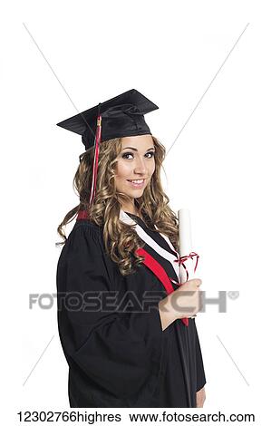 Young woman graduate holding her diploma in celebration of her graduation; Edmonton, Alberta, Canada View Large Photo Image Stock Photograph - Young woman graduate holding her diploma in celebration of her graduation; Edmonton, Alberta, Canada. Fotosearch