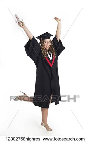 Young woman graduate holding her diploma up in celebration of her graduation; Edmonton, Alberta, Canada View Large Photo Image Stock Photograph - Young woman graduate holding her diploma up in celebration of her graduation; Edmonton, Alberta, Canada. Fotosearch