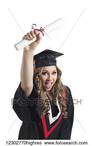 Young woman graduate holding her diploma up in celebration of her graduation; Edmonton, Alberta, Canada View Large Photo Image Stock Photograph - Young woman graduate holding her diploma up in celebration of her graduation; Edmonton, Alberta, Canada. Fotosearch