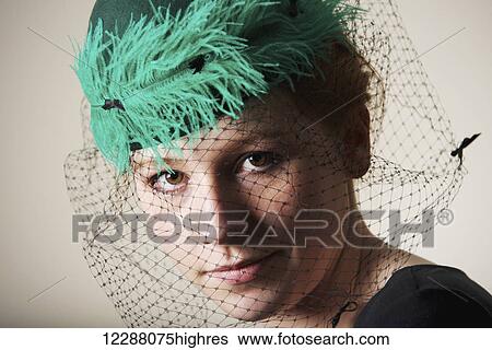 Young woman with red hair in a green veiled hat; Caldecott, England View Large Photo Image Stock Photograph - Young woman with red hair in a green veiled hat; Caldecott, England. Fotosearch